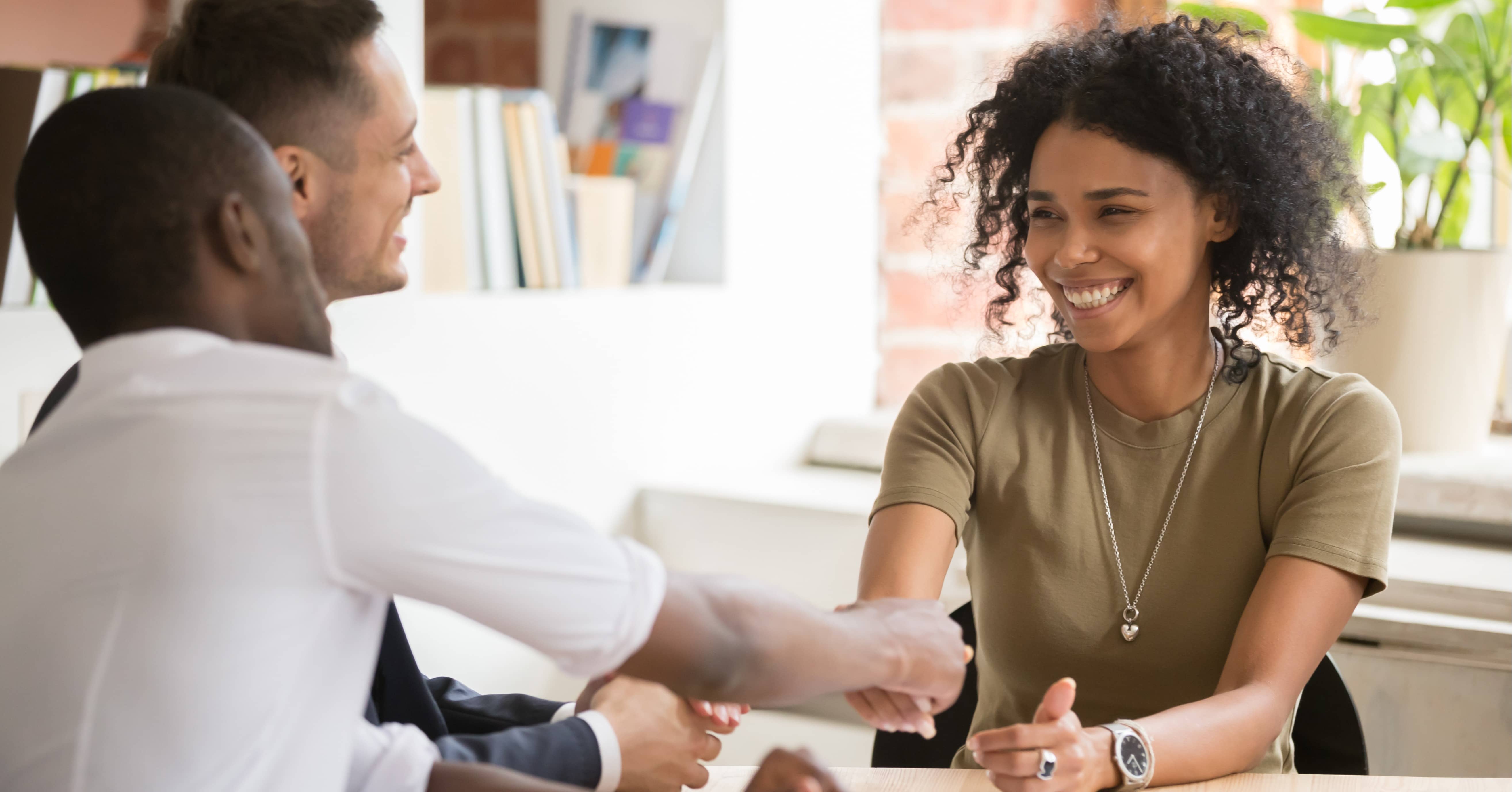 team members welcoming new managers